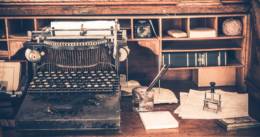 Old Desk with Vintage Typewriter. Aged Desk.
